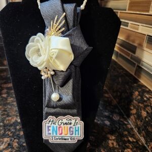 Elegant Black Tie with Floral Accent